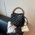 Black quilted bucket bag with crystal rhinestones and chunky bronze chain handle - Black