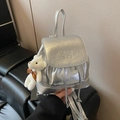 Metallic silver bucket backpack with crinkled texture and white plush bear keychain - Silver
