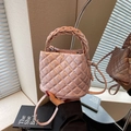 Pink quilted crossbody bucket bag with rhinestone details and a woven handle - Pink