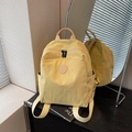 Light yellow lightweight nylon backpack with multiple pockets and a minimalist design - Yellow