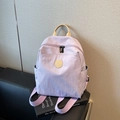 Lightweight lavender nylon backpack for women with leather handle and round logo patch - Purple