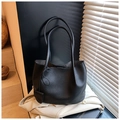 Detail of black lychee grain tote bag with micro charm pouch and long shoulder straps - Black