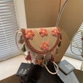 Bohemian woven bucket bag in cream with colorful wave patterns and pink crochet flowers - Off White