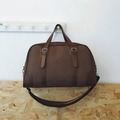 Vintage brown duffle bag with leather trim and wide shoulder strap for short travel - Brown