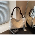 Elegant beige jacquard tote with wood bead handles and floral patterns in soft light - Off White