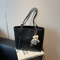Elegant black woven tote bag with slim shoulder straps and a cute teddy bear charm accessory - Black (with Pendant)