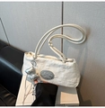 Detail of white nylon shoulder bag with 3D floral embroidery and silver bow charm - White with Pendant