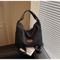 Versatile black canvas tote bag with brown leather tag and convertible shoulder straps - Black
