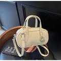 Chic beige lychee grain mini pillow bag with silver lock and adjustable strap - Off-white
