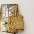 Handmade yellow straw macrame tote bag with decorative side tassels and woven handles - Brown