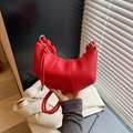 Red lychee grain crescent bag with stylish knot handle and metallic top zipper - Red