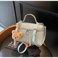 Chic mint blue pleated bucket bag with plush bear charm and adjustable strap - Blue