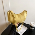Yellow croissant shoulder bag in lychee pattern leather with stylish knot details - Yellow