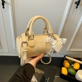 Creamy yellow cylinder handbag in pleated oil wax leather with pearl heart charm - Yellow