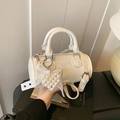 Retro cream white cylinder crossbody bag with a lace bow and pearl heart pendant - Off White