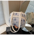 Detail of white quilted tote with vintage blue bear print and leather shoulder straps - Striped