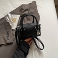 Chic black lychee leather Boston bag with silver lock and adjustable shoulder strap - Black