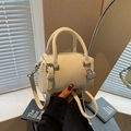 Minimalist beige pebble leather cylinder handbag with silver hardware and shoulder strap - Off-white