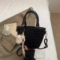 Black leather bucket bag with litchi texture and cute bear pendant accessory - Black with Pendant