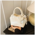 Detail of cream pleated leather mini bucket bag with pearl heart and lace bow accent - White with Pendant