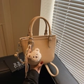 Beige lychee leather bucket bag with plush bear charm and checkered silk ribbon decoration - Khaki with Pendant