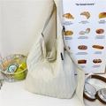 Light beige pleated canvas tote bag with wide strap for casual daily use - White