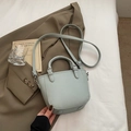 Minimalist mint green lychee pattern leather bucket bag with silver hardware accents - Blue Without Charm