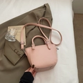Pale pink lychee grain crossbody bucket bag with elegant dual handles and strap - Pink Without Pendant