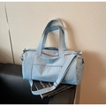 Detail of light blue yoga gym bag featuring adjustable shoulder straps and nylon texture - Blue