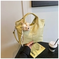 Detail of light yellow crocodile pattern handbag with plush bear charm and silk scarf - With Pendant / Yellow