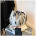 Detailed view of light gray nylon drawstring bucket bag with side mesh pocket and striped cord - Gray