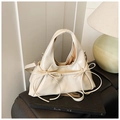 Chic cream white leather handbag with elegant bow details and silver hardware strap - White