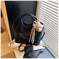 Detail of black crocodile texture tote bag with a cute white plush bear charm - Black with Pendant