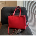 Vibrant red pebbled leather tote bag with dual handles and matching crossbody strap - Red