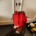 Fashionable red nylon drawstring bucket bag with textured fabric and side mesh pocket - Red