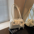 Creamy white pillow shoulder bag in matte leather with pearl pendant and wavy trim details - Beige With Charm