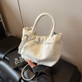 Minimalist creamy white bucket bag with pleated design and cylindrical top handle - White