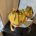 Yellow nylon drawstring bucket bag with side mesh pocket and decorative pattern bow - Yellow