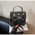 Dettaglio della borsa in tweed e pelle con quattro farfalle metalliche argentate - Nero
