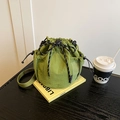 Grass green nylon drawstring bucket bag with woven ropes and mesh pocket on side - Fruit Green