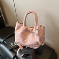Pink pleated bucket bag in soft PU leather with dual handles and silver hardware - Pink