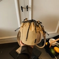 Khaki drawstring bucket bag in nylon with side mesh pocket and woven shoulder strap - Khaki