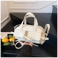 Close-up of cream Boston bag featuring glossy leather finish and fringe pocket detail - Off White