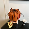 Vibrant orange drawstring bucket bag with sporty woven cords and mesh side pocket detail - Orange
