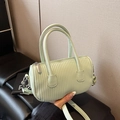 Mint green pleated cylinder crossbody bag with wavy embossed faux leather finish - Green