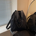 Minimalist black plaid nylon drawstring backpack with top handle and side brand label - Black