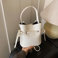 Chic white faux leather bucket bag with drawstring closure and soft single handle - White