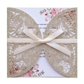 Detail of laser-cut glitter wedding invitation with cream ribbon and floral inner card - Light Gold Color