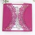 Elegant laser-cut magenta wedding invitation with white insert and floral hollow patterns - Fuschia