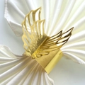 Close-up of golden butterfly napkin ring with hollow wings on white satin napkin - 20cm / Mirror Gold